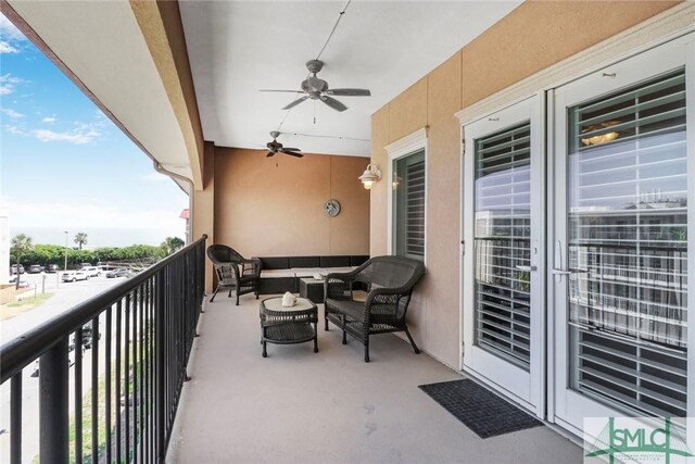 balcony featuring ceiling fan and an outdoor living space