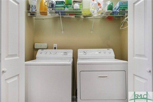 laundry room featuring separate washer and dryer