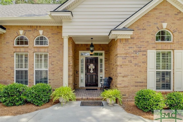 entrance to property with brick siding