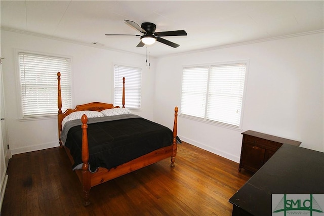 bedroom with ornamental molding, wood finished floors, baseboards, and a ceiling fan