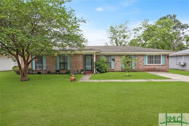 ranch-style home with brick siding and a front yard