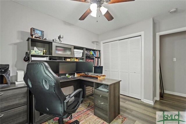 office featuring ceiling fan, wood finished floors, and baseboards