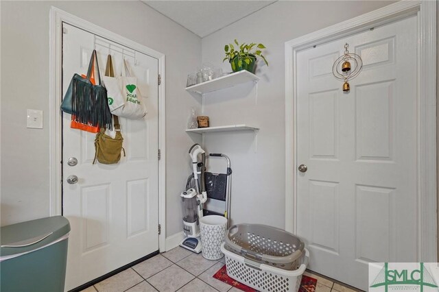 mudroom with light tile patterned flooring