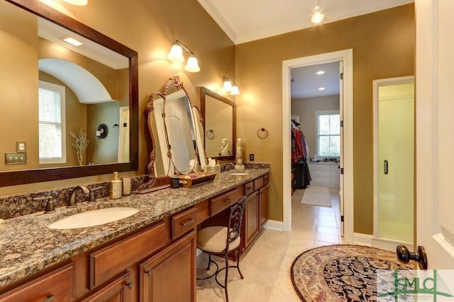 18 Enclave Cir, Savannah, GA 31419 - bathroom featuring double vanity, tile patterned floors, a walk in closet, crown molding, and baseboards