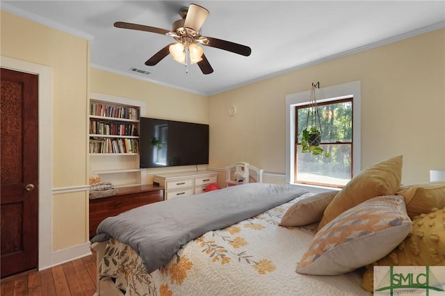 309 E 5th St, Rincon, GA 31326 - bedroom featuring hardwood / wood-style flooring, crown molding, a ceiling fan, and baseboards