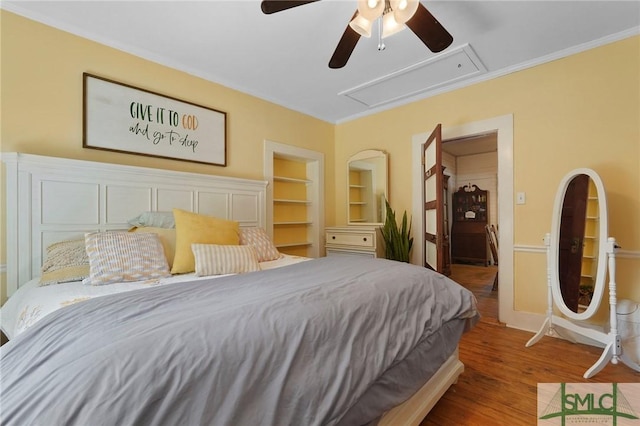 309 E 5th St, Rincon, GA 31326 - bedroom featuring attic access, wood finished floors, crown molding, ceiling fan, and baseboards