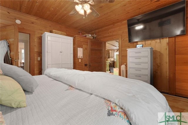 309 E 5th St, Rincon, GA 31326 - bedroom featuring wood walls, wood finished floors, wood ceiling, and a ceiling fan