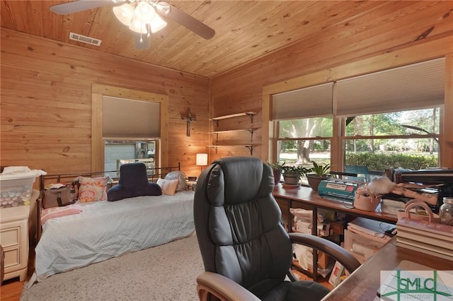 309 E 5th St, Rincon, GA 31326 - bedroom with an office area, wooden walls, and wood ceiling