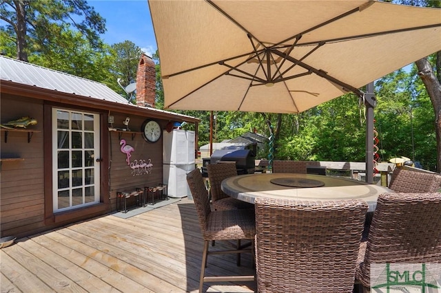 309 E 5th St, Rincon, GA 31326 - wooden terrace with outdoor dining area