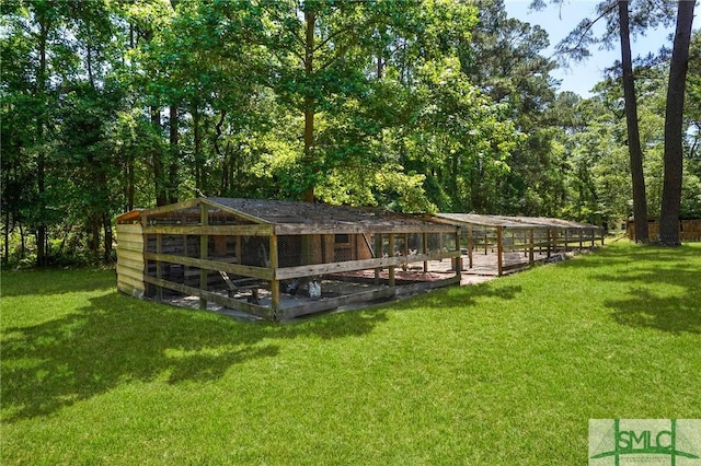 309 E 5th St, Rincon, GA 31326 - surrounding community with exterior structure, an outbuilding, and a yard