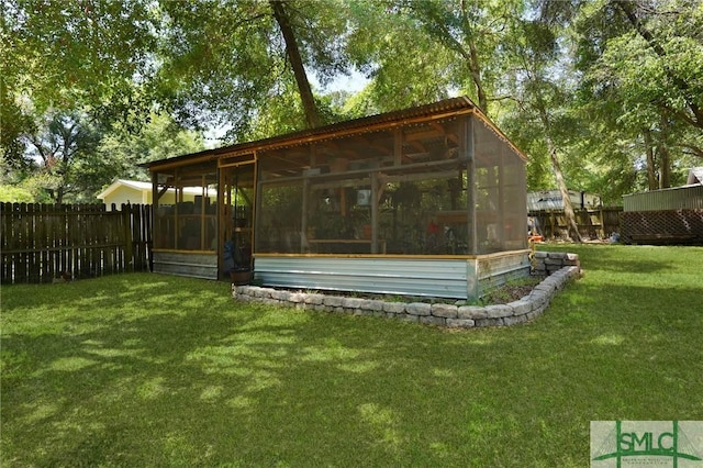 309 E 5th St, Rincon, GA 31326 - view of yard featuring a sunroom