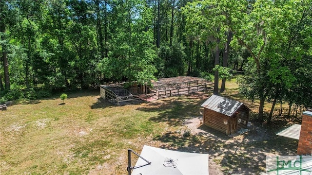 309 E 5th St, Rincon, GA 31326 - view of green lawn with a storage shed and an outdoor structure