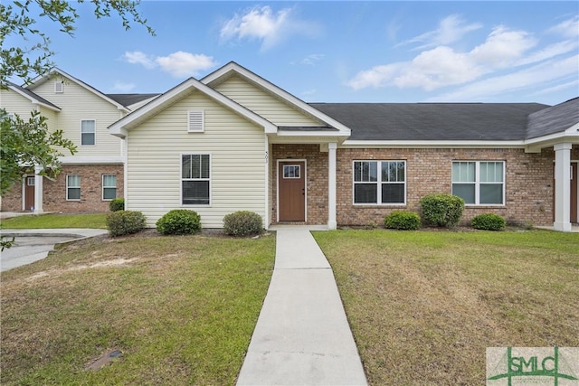 503 Potter Stone Sq, Pooler, GA 31322 - view of front of home with a front yard, brick siding, and a shingled roof