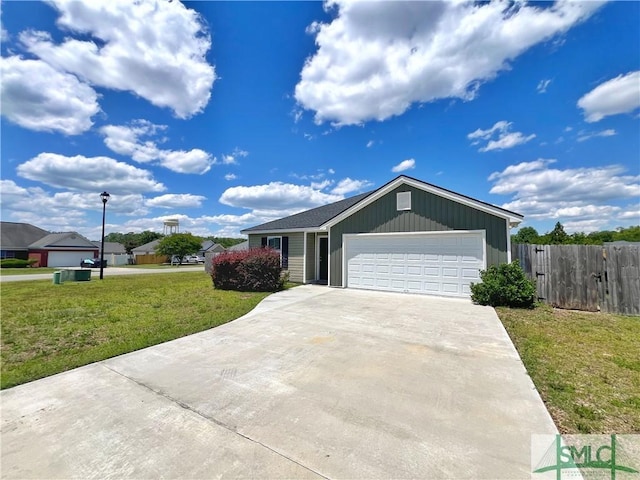 111 Auburn Cir, Glennville, GA 30427 - ranch-style home with concrete driveway, an attached garage, and board and batten siding