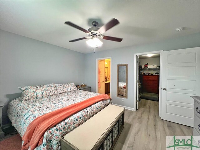 111 Auburn Cir, Glennville, GA 30427 - bedroom with a spacious closet, light wood-style flooring, a closet, ceiling fan, and baseboards