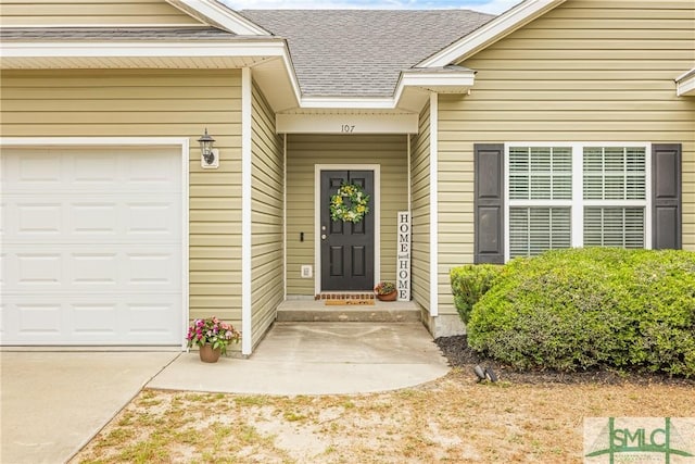107 Christian Ct, Rincon, GA 31326 - entrance to property featuring roof with shingles, an attached garage, and concrete driveway