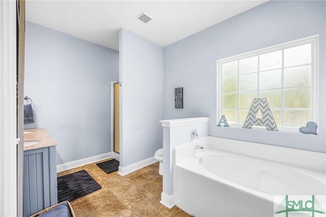 107 Christian Ct, Rincon, GA 31326 - bathroom with toilet, baseboards, a garden tub, a stall shower, and vanity