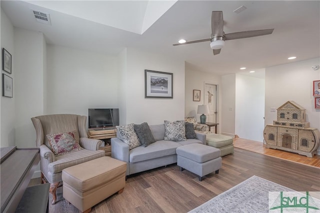 living room with ceiling fan, wood finished floors, and recessed lighting