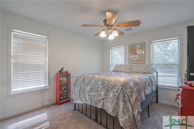 bedroom featuring multiple windows, carpet, baseboards, and crown molding