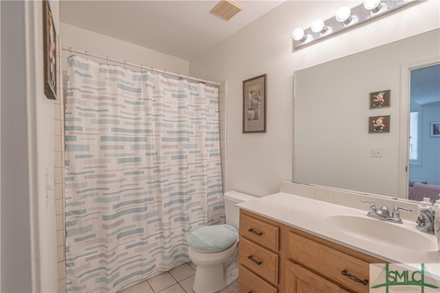 full bath with toilet, tile patterned flooring, vanity, and curtained shower