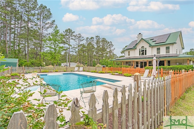 view of swimming pool featuring a patio area and a fenced backyard
