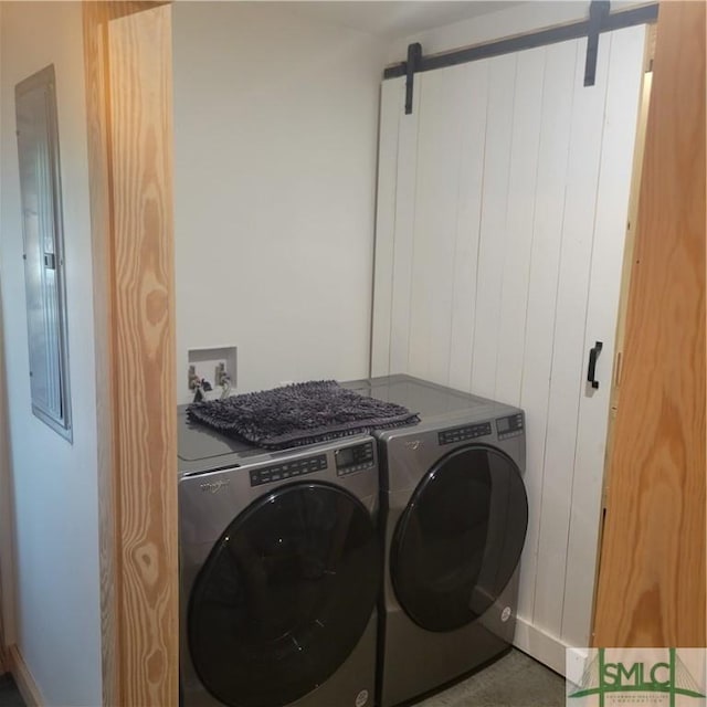 26 Cason Dr, Pembroke, GA 31321 - washroom with a barn door and independent washer and dryer