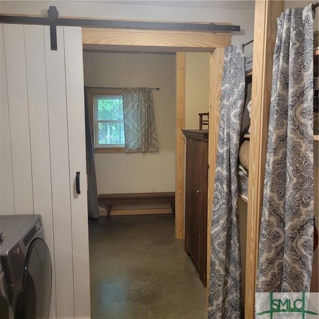 26 Cason Dr, Pembroke, GA 31321 - corridor featuring washer / dryer, a barn door, and baseboards