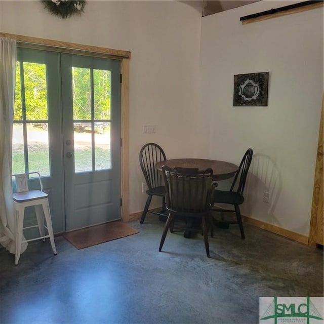 26 Cason Dr, Pembroke, GA 31321 - dining space with concrete floors and french doors