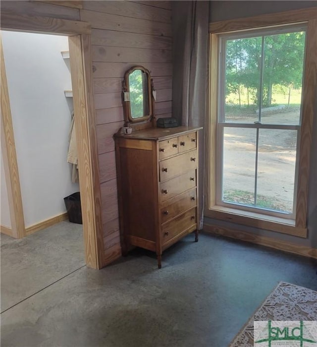 26 Cason Dr, Pembroke, GA 31321 - bedroom with multiple windows, baseboards, and wooden walls