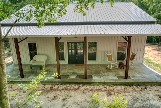 26 Cason Dr, Pembroke, GA 31321 - back of property with french doors, a patio area, and a metal roof