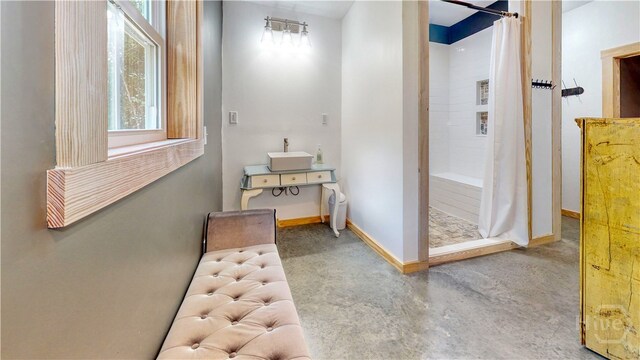 26 Cason Dr, Pembroke, GA 31321 - hallway featuring finished concrete flooring and baseboards
