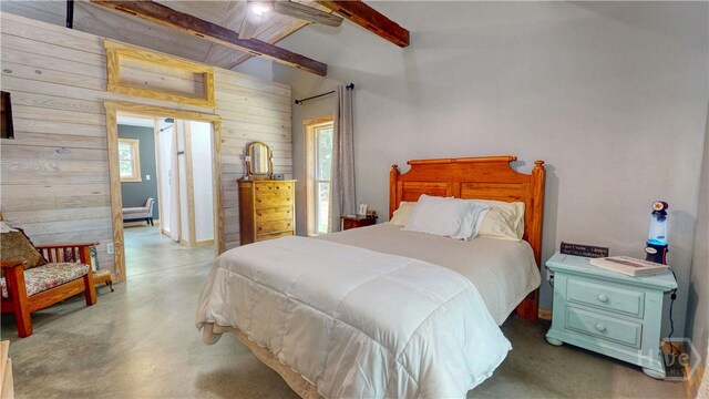 26 Cason Dr, Pembroke, GA 31321 - bedroom featuring wood walls, concrete floors, multiple windows, and a ceiling fan