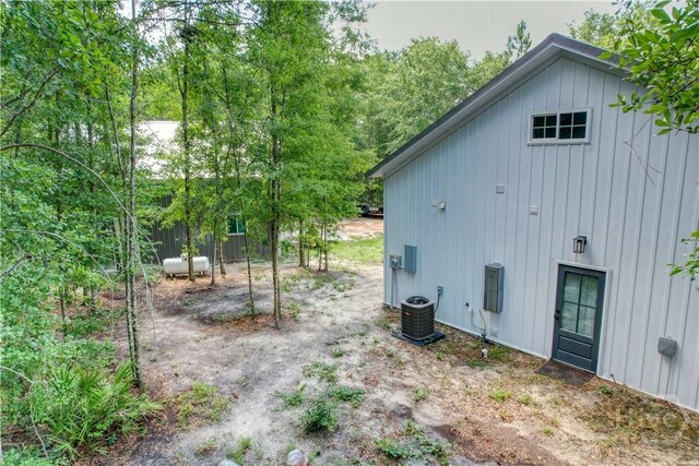 26 Cason Dr, Pembroke, GA 31321 - rear view of property with board and batten siding