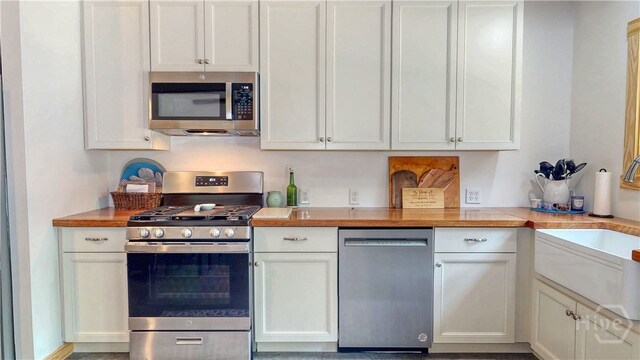 26 Cason Dr, Pembroke, GA 31321 - kitchen featuring appliances with stainless steel finishes and white cabinets