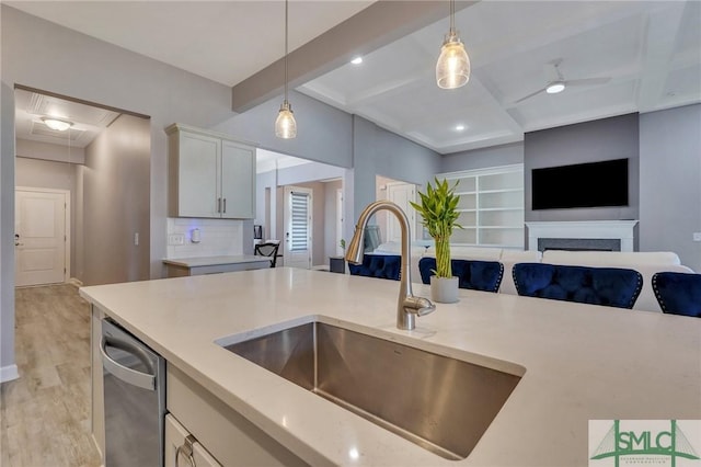 206 Park Chase Chase, Pooler, GA 31322 - kitchen with a sink, stainless steel dishwasher, light wood-style floors, decorative light fixtures, and open floor plan