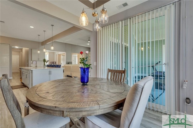 206 Park Chase Chase, Pooler, GA 31322 - dining space with light wood-style floors, a chandelier, and beamed ceiling