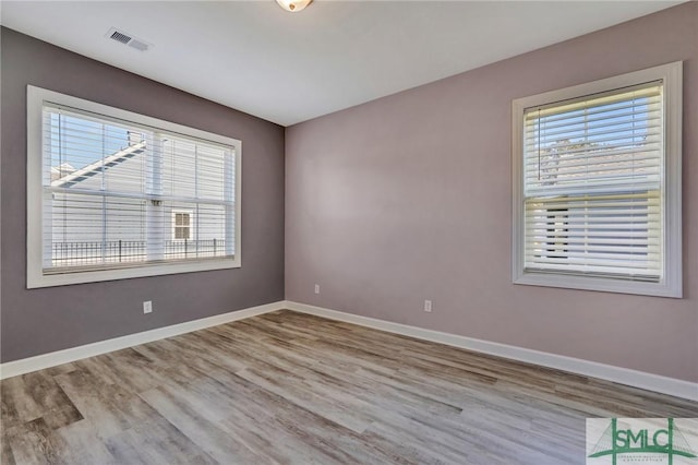 206 Park Chase Chase, Pooler, GA 31322 - unfurnished room with plenty of natural light, wood finished floors, and baseboards