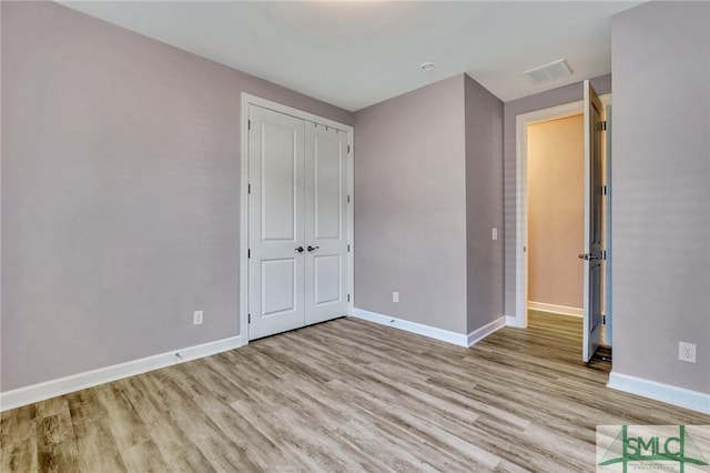 206 Park Chase Chase, Pooler, GA 31322 - unfurnished bedroom with light wood-type flooring, baseboards, and a closet