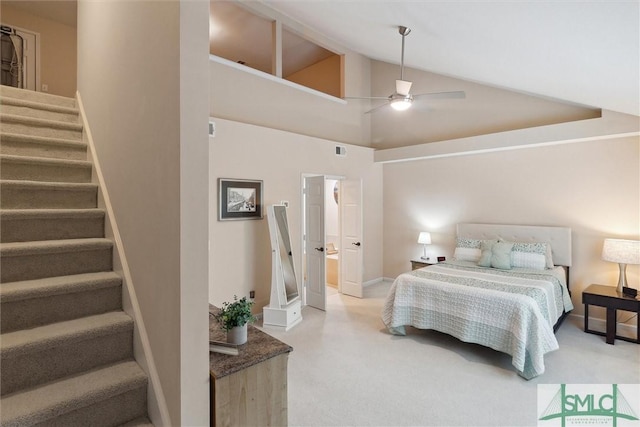 bedroom featuring carpet floors, vaulted ceiling, ceiling fan, and baseboards