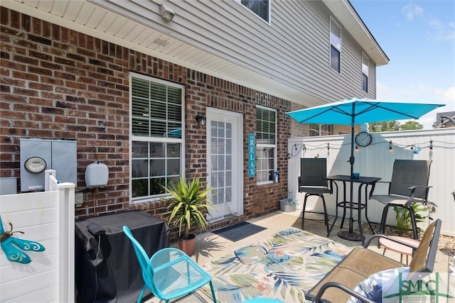 view of patio featuring fence