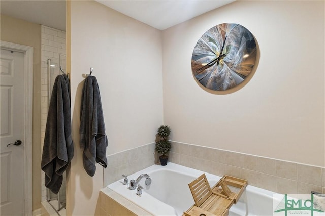 full bath with a bath and a tile shower