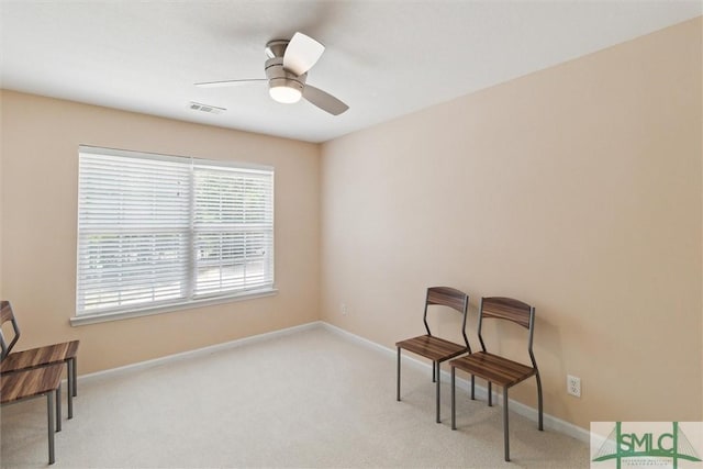 unfurnished room featuring carpet floors, a ceiling fan, and baseboards