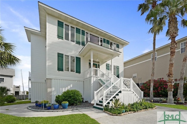 15 Teresa Ln, Tybee Island, GA 31328 - view of front of property with stairway and a porch