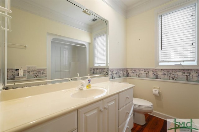15 Teresa Ln, Tybee Island, GA 31328 - bathroom featuring ornamental molding, toilet, wood finished floors, and vanity