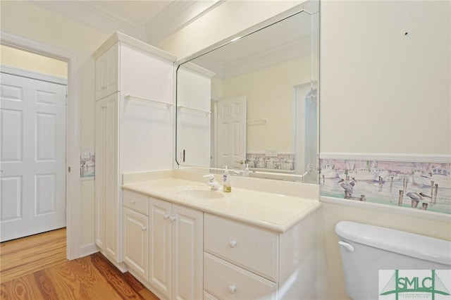 15 Teresa Ln, Tybee Island, GA 31328 - bathroom with toilet, crown molding, wood finished floors, and vanity