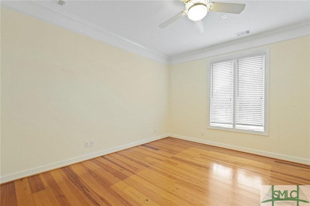 15 Teresa Ln, Tybee Island, GA 31328 - unfurnished room with crown molding, baseboards, light wood-type flooring, and a ceiling fan