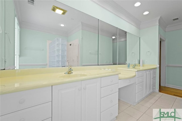 15 Teresa Ln, Tybee Island, GA 31328 - bathroom featuring ornamental molding, tile patterned flooring, vanity, and recessed lighting