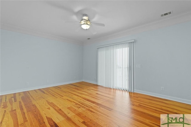 15 Teresa Ln, Tybee Island, GA 31328 - unfurnished room with crown molding, ceiling fan, wood finished floors, and baseboards