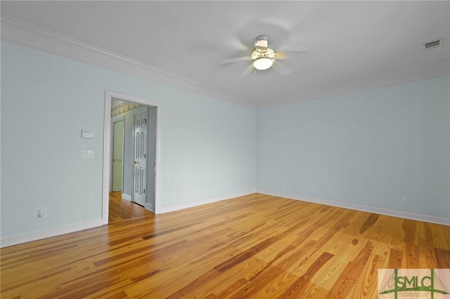 15 Teresa Ln, Tybee Island, GA 31328 - unfurnished room featuring a ceiling fan, light wood-style flooring, crown molding, and baseboards
