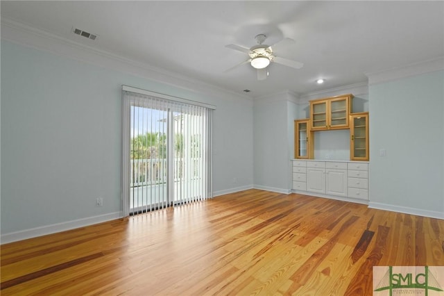 15 Teresa Ln, Tybee Island, GA 31328 - spare room with crown molding, ceiling fan, light wood-type flooring, and baseboards